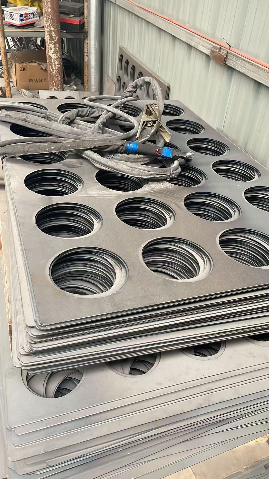CNC cut tube sheet for dust collector