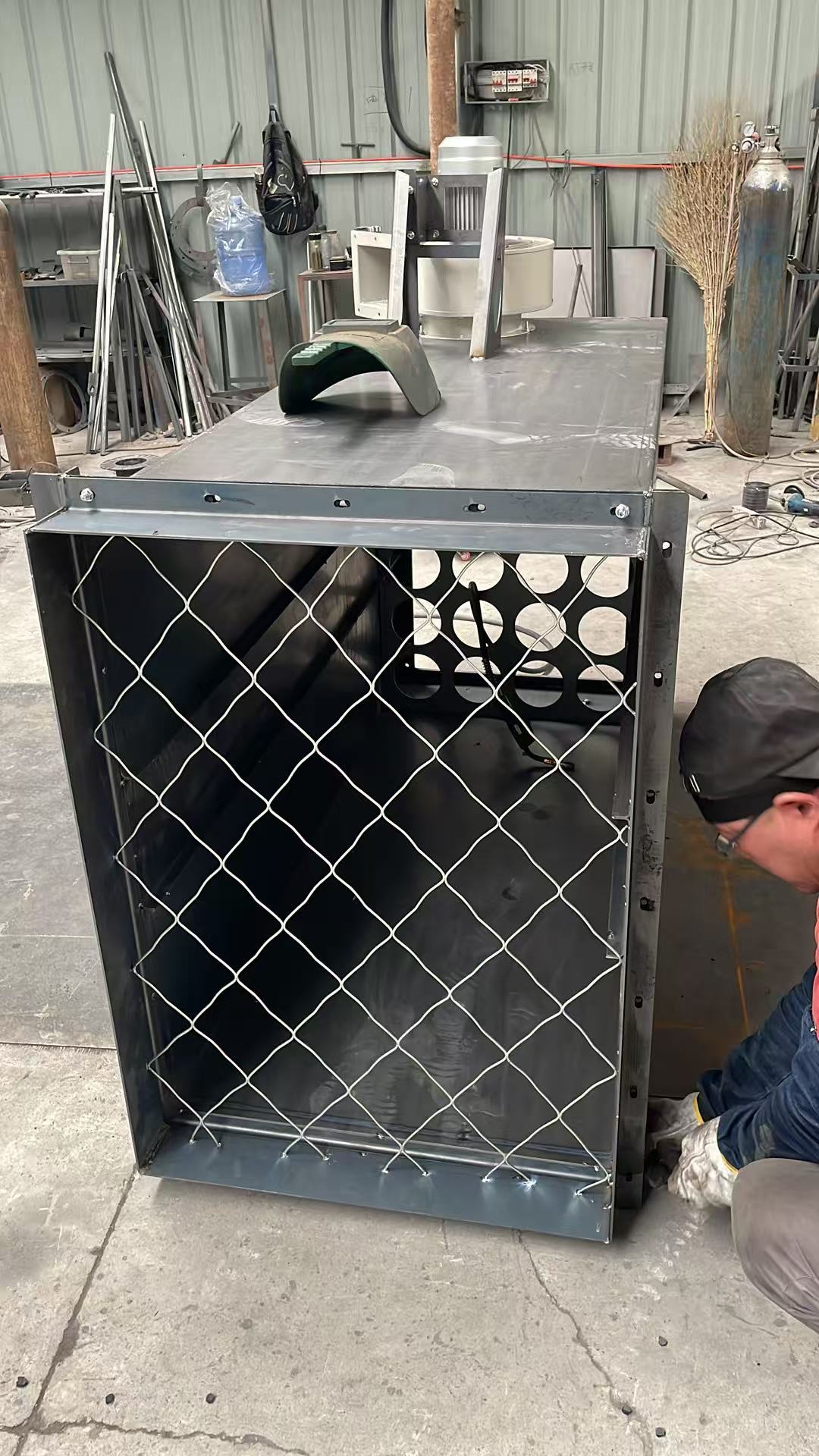 Dust collector housing under workshop fabrication